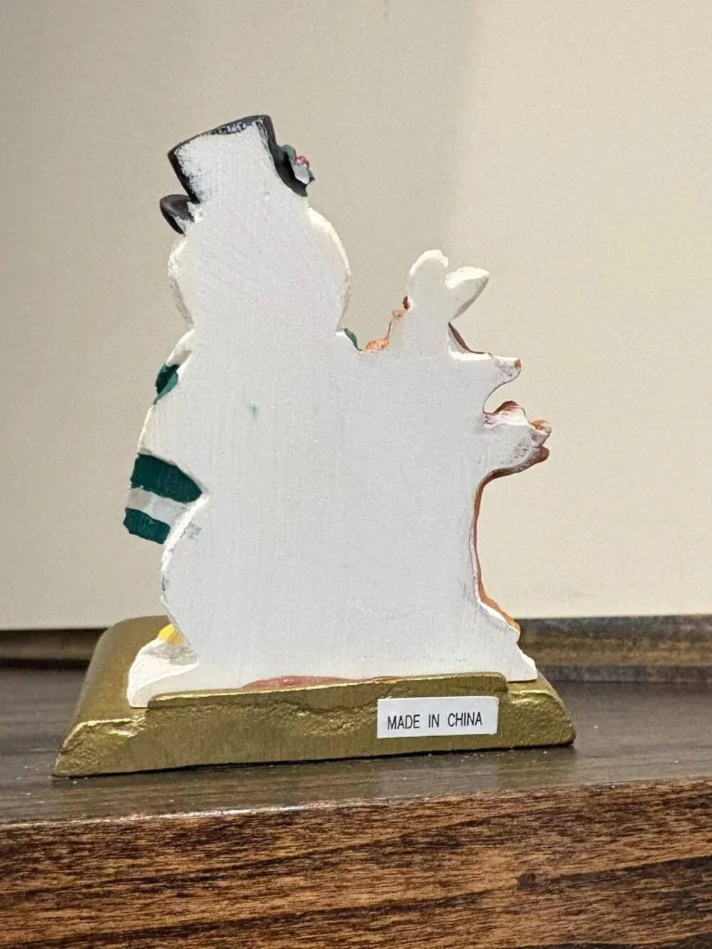 Vintage cast iron stocking holder on a gold base, box, snowman with cardinal